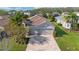Beautiful aerial view of a well-maintained home with a tile roof and landscaping at 30174 Southernwood Ct, Wesley Chapel, FL 33543
