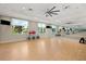 Bright gym with exercise equipment, mirrors, and ample space for various fitness activities at 30174 Southernwood Ct, Wesley Chapel, FL 33543