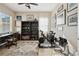 Functional home office features a desk, exercise bike and ample storage for a productive workspace at 30174 Southernwood Ct, Wesley Chapel, FL 33543