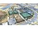 Aerial shot showcases community tennis courts, clubhouse, and well-manicured landscaping at 31408 Cabana Rye Ave, San Antonio, FL 33576