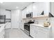 Bright kitchen features white cabinets, stainless steel appliances, and sleek countertops at 31408 Cabana Rye Ave, San Antonio, FL 33576