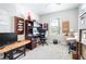 Bright office space with multiple desks, organizers, and natural light from the window at 31408 Cabana Rye Ave, San Antonio, FL 33576