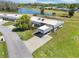 Overhead view of property showcasing manicured lawns, carport, and lush surroundings at 3252 Scorecard Dr, New Port Richey, FL 34655