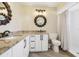 Well-lit bathroom featuring double sinks, granite countertops, and modern light fixtures at 3252 Scorecard Dr, New Port Richey, FL 34655