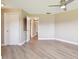 Spacious bedroom features neutral walls, light wood-look flooring, and ample closet space at 3252 Scorecard Dr, New Port Richey, FL 34655