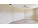 Bright bedroom features neutral walls, wood-look flooring, and a modern ceiling fan at 3252 Scorecard Dr, New Port Richey, FL 34655
