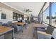 Outdoor dining area at Seven Springs Golf & Country Club with tables, chairs, and ceiling fans at 3252 Scorecard Dr, New Port Richey, FL 34655