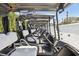 Row of golf carts lined up, ready for a day on the course under a sunny sky at 3252 Scorecard Dr, New Port Richey, FL 34655