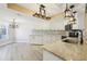 Modern kitchen featuring white cabinets, stylish backsplash and stainless-steel appliances at 3252 Scorecard Dr, New Port Richey, FL 34655