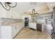 This stunning kitchen features stainless steel appliances and light countertops at 3252 Scorecard Dr, New Port Richey, FL 34655