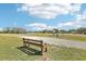 Scenic view of the community with walking path and the lake on a beautiful day at 3252 Scorecard Dr, New Port Richey, FL 34655