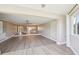Open living space with seamless flooring leading to a sunroom, enhancing the home's appeal at 3252 Scorecard Dr, New Port Richey, FL 34655