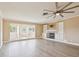 Spacious living area featuring updated fireplace and lots of natural light from a sunroom at 3252 Scorecard Dr, New Port Richey, FL 34655