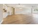Spacious living area with sleek flooring adjoins the kitchen, perfect for entertaining at 3252 Scorecard Dr, New Port Richey, FL 34655