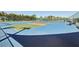 Well-maintained tennis and pickleball courts with blue and green surfaces, ideal for sports and recreation at 3252 Scorecard Dr, New Port Richey, FL 34655