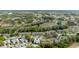 Aerial view of a residential community near a golf course, showcasing the lush green landscape at 3254 Lori Ln, New Port Richey, FL 34655