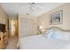 Comfortable bedroom with a ceiling fan, closet, and a bright window at 3254 Lori Ln, New Port Richey, FL 34655