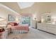 Bright bedroom featuring a high ceiling and sliding doors leading to the outdoors at 3254 Lori Ln, New Port Richey, FL 34655