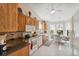 Well-equipped kitchen features wood cabinetry, granite countertops, a casual dining area, and updated appliances at 3254 Lori Ln, New Port Richey, FL 34655