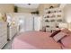 Serene main bedroom with a high ceiling, white furniture, and an abundance of closet space at 3254 Lori Ln, New Port Richey, FL 34655