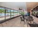 Large tiled patio features seating, tables and ceiling fans with views of a swimming pool at 3254 Lori Ln, New Port Richey, FL 34655