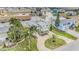 An aerial view of a waterfront house highlighting the lush landscaping, canals, and neighborhood layout at 3432 Bluefish Dr, Hernando Beach, FL 34607