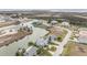 Aerial view of waterfront homes nestled along a scenic canal with access to the open water at 3432 Bluefish Dr, Hernando Beach, FL 34607