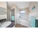 Relaxing bathroom features a soaking tub with tiled surround, walk-in shower, and spacious vanity at 3432 Bluefish Dr, Hernando Beach, FL 34607