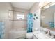 Charming bathroom features tiled shower, toilet, vanity, and unique decor accents at 3432 Bluefish Dr, Hernando Beach, FL 34607