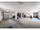 Spacious garage providing secure parking and ample storage, equipped with an automatic door and interior lighting at 3432 Bluefish Dr, Hernando Beach, FL 34607