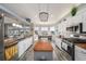 Bright kitchen boasts stainless appliances, a large center island, ample counter space and a connecting dining area at 3432 Bluefish Dr, Hernando Beach, FL 34607