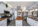 Well-equipped kitchen featuring stainless steel appliances, ample counter space, and modern backsplash at 3432 Bluefish Dr, Hernando Beach, FL 34607