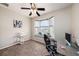Bright office space featuring a large bay window, comfortable seating, and functional workspace at 3432 Bluefish Dr, Hernando Beach, FL 34607