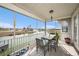 Inviting screened porch with dining set and serene canal views, ideal for enjoying outdoor meals at 3432 Bluefish Dr, Hernando Beach, FL 34607