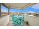 Enclosed patio featuring a cozy outdoor dining set and scenic canal view, perfect for enjoying serene outdoor dining at 3432 Bluefish Dr, Hernando Beach, FL 34607