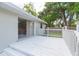Image of the exterior back porch, overlooking the spacious backyard at 3502 Bloomingdale Ave, Valrico, FL 33596