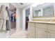 Bathroom with granite vanity, and walk in closet is adjacent to the toilet/shower at 3502 Bloomingdale Ave, Valrico, FL 33596