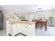 Open concept kitchen and dining area, perfect for entertaining, with granite countertops at 3502 Bloomingdale Ave, Valrico, FL 33596