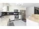Stylish kitchen with granite countertops, stainless steel appliances, and custom backsplash design at 3502 Bloomingdale Ave, Valrico, FL 33596