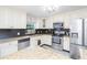 Updated kitchen with granite countertops, stainless steel appliances, and sleek cabinetry for a modern look at 3502 Bloomingdale Ave, Valrico, FL 33596