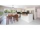 Bright kitchen with white cabinetry, stainless steel appliances, and a breakfast bar for casual dining at 3502 Bloomingdale Ave, Valrico, FL 33596