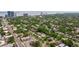 Beautiful aerial view of a neighborhood with lush greenery and the city skyline in the distance at 3512 W Santiago St, Tampa, FL 33629