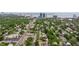 A picturesque neighborhood is displayed from above, showcasing mature landscaping and the city skyline at 3512 W Santiago St, Tampa, FL 33629
