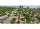 Aerial view of the neighborhood with lush greenery and a clear view of the city skyline at 3512 W Santiago St, Tampa, FL 33629