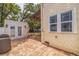 Charming backyard with brick patio, wooden deck, and pergola at 3512 W Santiago St, Tampa, FL 33629