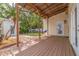 Inviting backyard deck with a covered area, a swing, and a fire pit at 3512 W Santiago St, Tampa, FL 33629