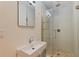 Modern bathroom features a glass shower and stone-tiled floor at 3512 W Santiago St, Tampa, FL 33629