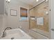 Bathroom features a shower with stone tile and a modern sink at 3512 W Santiago St, Tampa, FL 33629