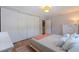 Bedroom with hardwood floors, closet, and white dresser at 3512 W Santiago St, Tampa, FL 33629
