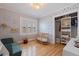 Bright Bedroom with hardwood floors, a crib, a sofa, and a closet at 3512 W Santiago St, Tampa, FL 33629